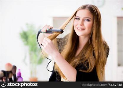 Woman styling her hair with hairdryer