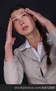 Woman suffering from a throbbing headache