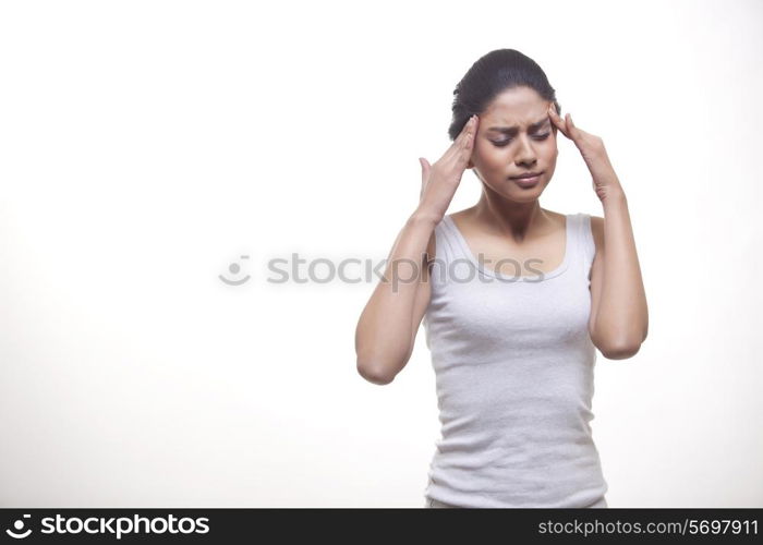 Woman suffering from headache isolated over white background