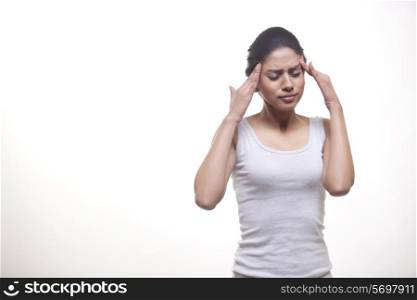 Woman suffering from headache isolated over white background