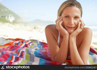 Woman Sunbathing on Beach