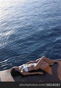 Woman Sunbathing on Boat