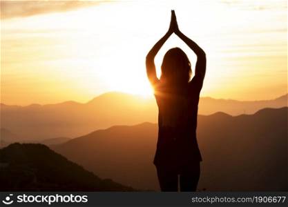 woman sunset doing yoga. High resolution photo. woman sunset doing yoga. High quality photo