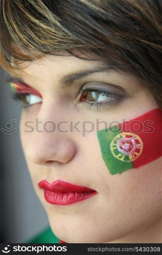 Woman supporting the Portuguese football team