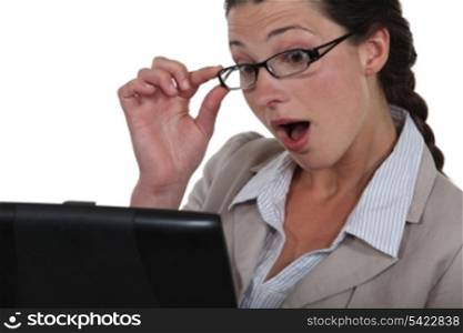Woman surprised at her laptop