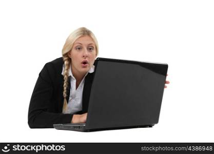 Woman surprised in front of a computer