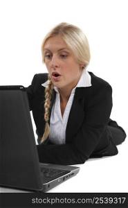 Woman surprised in front of laptop