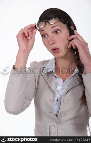 woman surprised on the phone