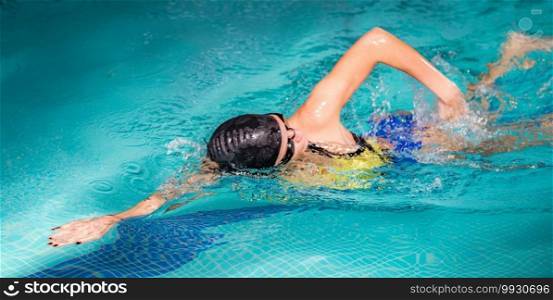 Woman Swimming in The Swimming Pool.. Recreational Front Crawl Swimming in The Pool.