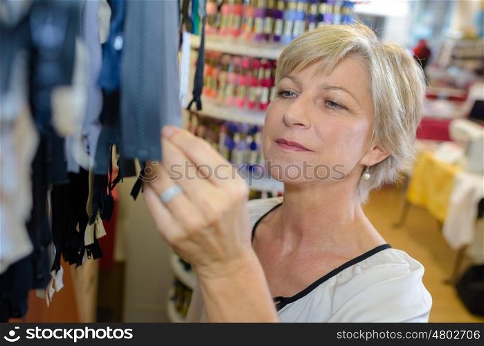 woman tailor checking on new clothing