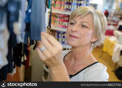 woman tailor checking on new clothing