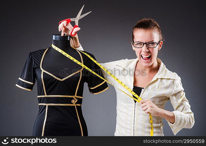 Woman tailor working on clothing