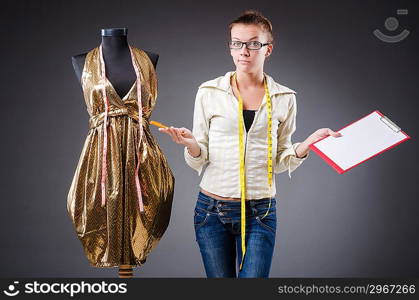 Woman tailor working on clothing