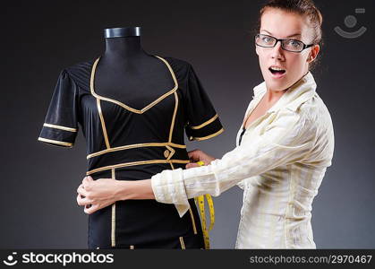 Woman tailor working on clothing