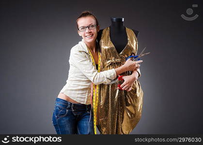 Woman tailor working on clothing