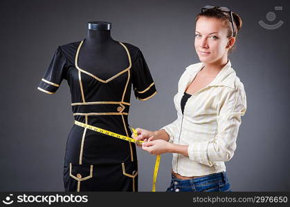 Woman tailor working on clothing