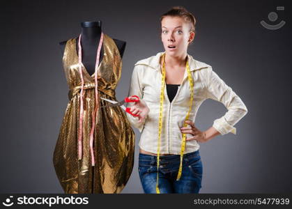 Woman tailor working on clothing