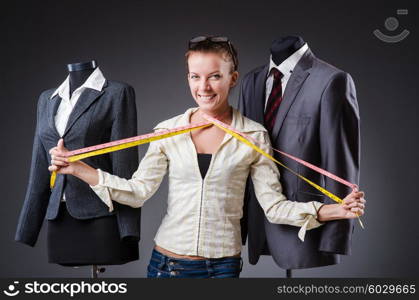 Woman tailor working on clothing