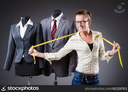 Woman tailor working on clothing