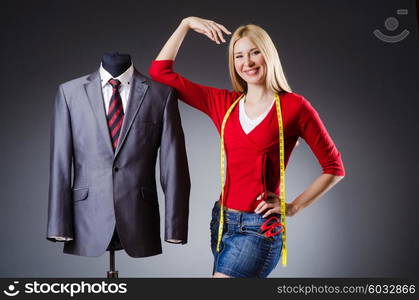 Woman tailor working on clothing