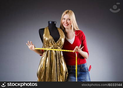 Woman tailor working on clothing