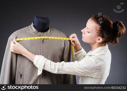 Woman tailor working on clothing