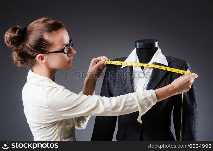Woman tailor working on clothing