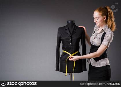 Woman tailor working on new dress