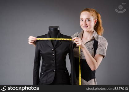 Woman tailor working on new dress