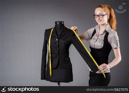 Woman tailor working on new dress