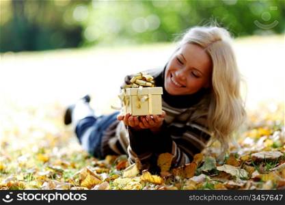 woman take autumn gift in park