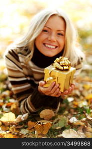 woman take autumn gift in park