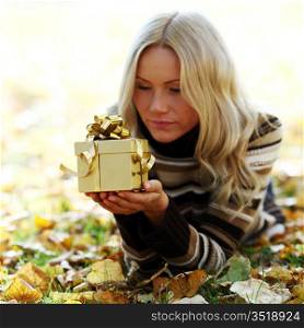 woman take autumn gift in park