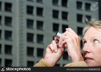 Woman taking a photograph