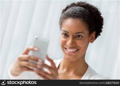 Woman taking a picture of herself with a phone
