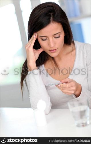 Woman taking drugs to releave headache