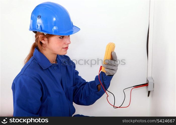 Woman taking electrical reading