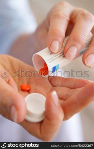 Woman taking medicine