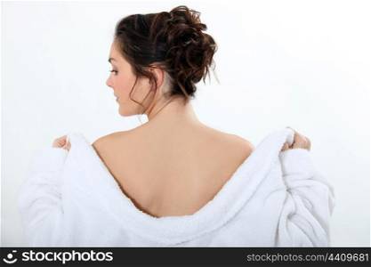 Woman taking off her robe