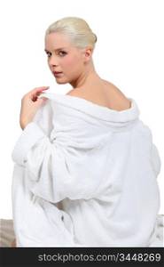 Woman taking off robe