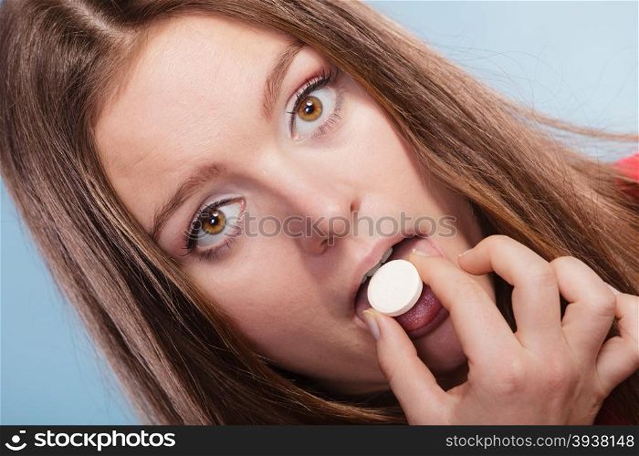 Woman taking painkiller pill tablet. Health care.. Woman girl taking swallowing painkiller pill tablet. Health care. Headache and pain.