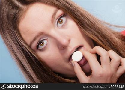 Woman taking painkiller pill tablet. Health care.. Woman girl taking swallowing painkiller pill tablet. Health care. Headache and pain.