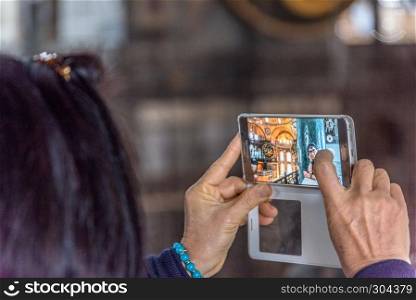 Woman taking photo in Hagia Sophia,Greek Orthodox Christian patriarchal basilica,church.Istanbul, Turkey,March,11 2017.. Woman taking photo in Hagia Sophia,Greek Orthodox Christian patriarchal basilica,church