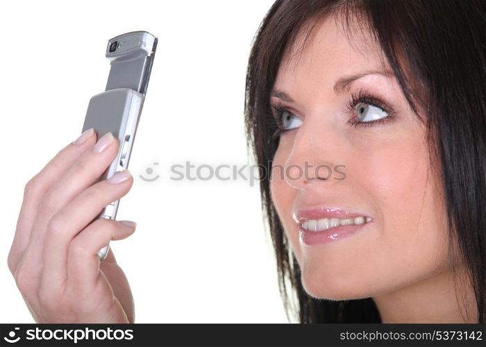 Woman taking picture with mobile phone