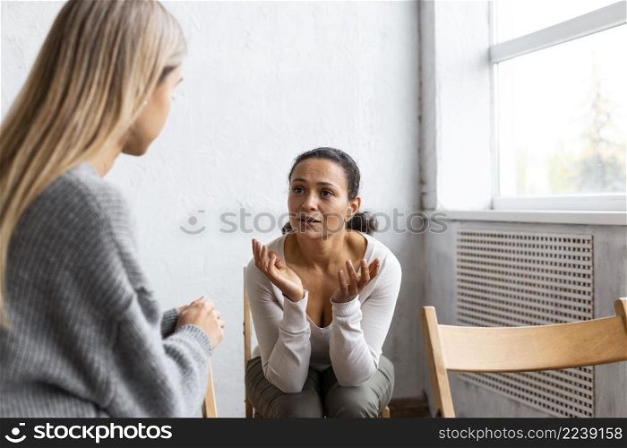 woman talking about her problems group therapy session