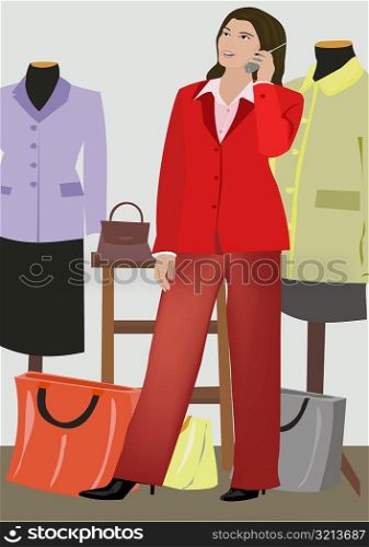 Woman talking on a mobile phone in a clothing store