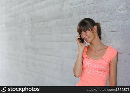 Woman talking on cell phone outdoors