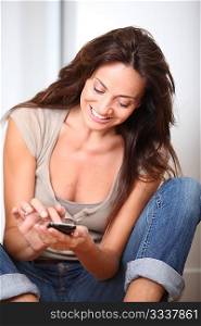 Woman talking on mobile phone at home