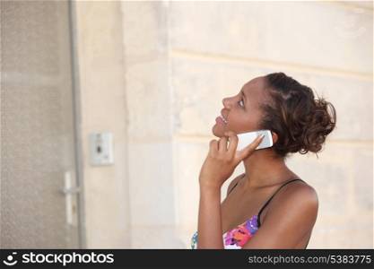 Woman talking on the phone outside