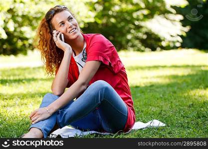 Woman talking over the phone in park